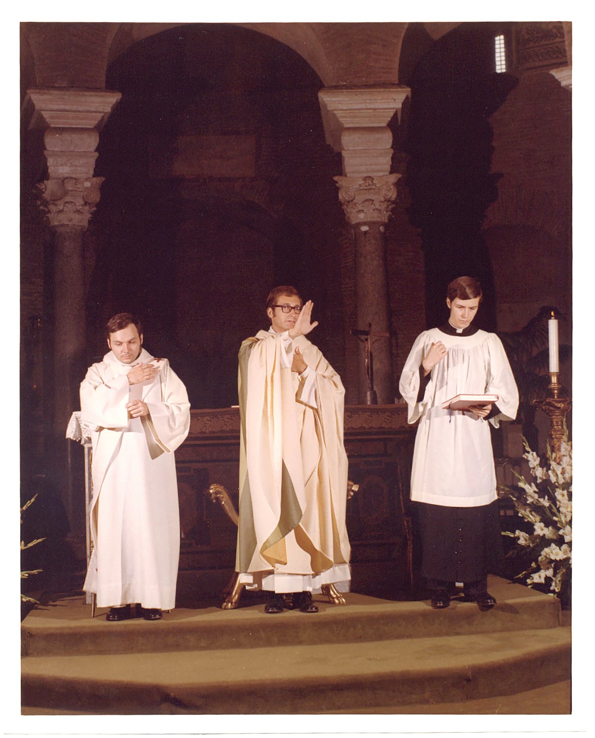 Then Father Robert C. Evans offers a blessing at his first Mass after he was ordained to the priesthood in 1973.